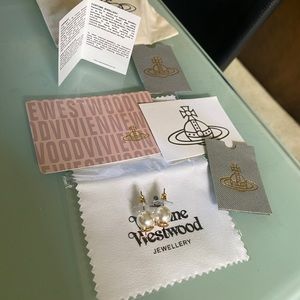 Pearl and gold designer studs